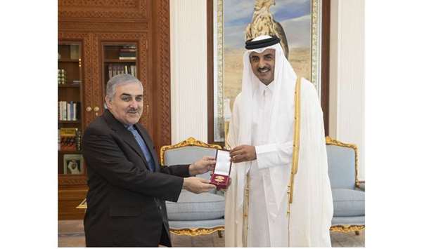 His Highness the Amir Sheikh Tamim bin Hamad al-Thani grants Mohamed Ali Subhani, the Iranian ambassador to Qatar, Al Wajbah Decoration