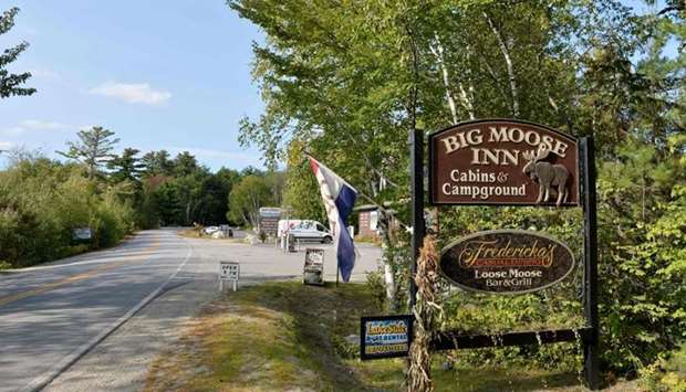The entrance sign for the Big Moose Inn, Cabins, & Campground where a wedding, connected to seven deaths and over 170 Covid-19 infections, took place on August 7 is seen in Millinocket, Maine on September 17.