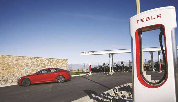A Tesla Model S electric vehicle exits after charging at the Tesla Tejon Ranch Supercharger station in Lebec, California (file).
