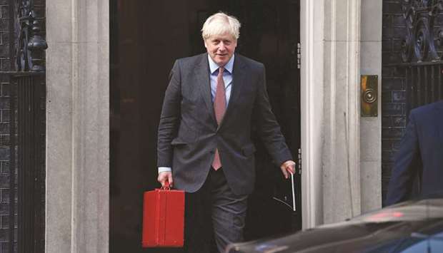 Prime Minister Boris Johnson reacts as he leaves 10 Downing Street in central London yesterday.