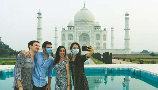 A group of friends take a selfie as they visit the Taj Mahal yesterday.