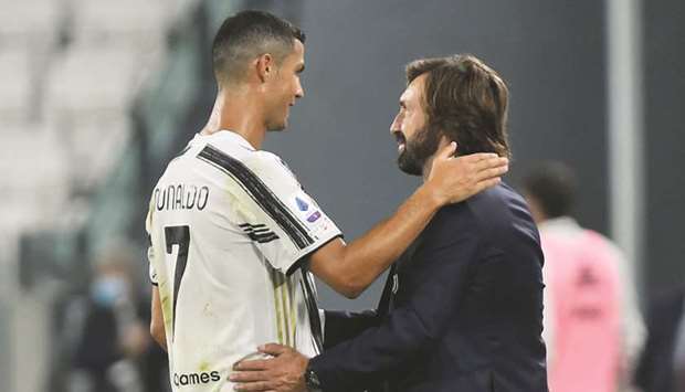 Juventusu2019 Cristiano Ronaldo and coach Andrea Pirlo celebrate their win over Sampdoria in Turin. (Reuters)