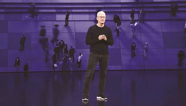 Apple CEO Tim Cook speaks during an event at the Steve Jobs Theater in Cupertino, California. Disasters should sway those denying science that shows greenhouse gases are dangerously changing weather patterns, Cook said in a talk streamed during an online event by The Atlantic magazine.