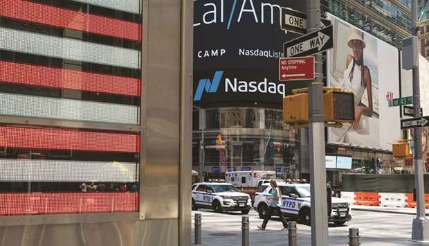 Signage is displayed outside the Nasdaq MarketSite in New York.