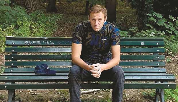 Russian opposition leader Alexei Navalny sits on a bench in Berlin yesterday. Navalny has been discharged from hospital after a month, his doctors in Berlin said.