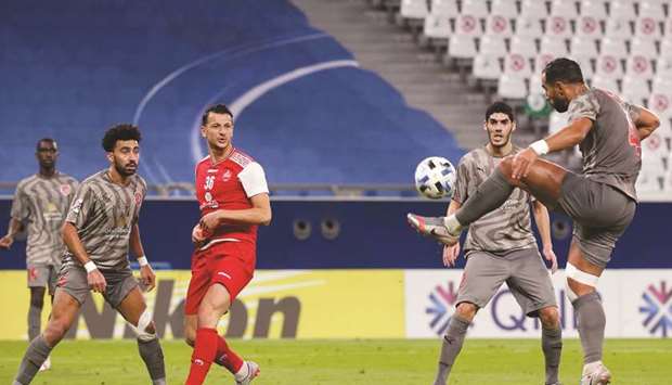 Duhailu2019s Medhi Benatia (right) clears the ball during the AFC Champions League Group C match against Iranu2019s Persepolis at the Education City Stadium on Monday. (AFP)