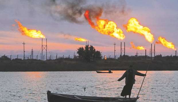 Flames emerge from flare stacks at the oil fields in Basra, Iraq (file).