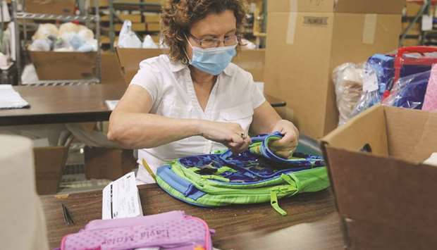 An employee works at the Gifts For You company warehouse in Woodridge, Illinois. The weekly jobless claims report from the Labour Department yesterday showed 26mn people were on unemployment benefits in early September.