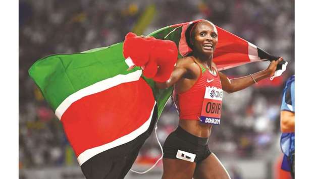 Kenyau2019s Hellen Obiri celebrates winning gold in the womenu2019s 5000m final at the Khalifa International Stadium at the Doha 2019 World Athletics Championships.