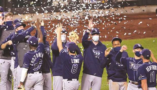 The Tampa Bay Rays celebrate clinching the American League East division title with confetti cannons after defeating the New York Mets at Citi Field. (USA TODAY Sports)