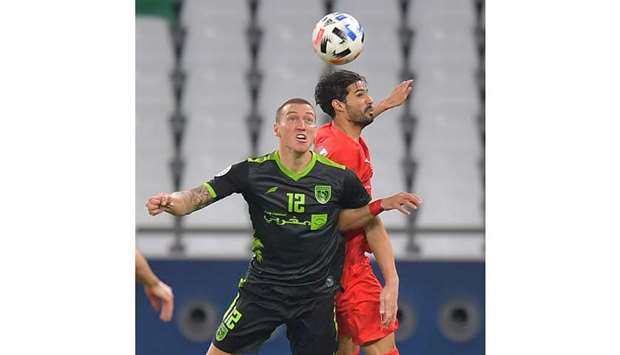 Action from the match between Al Duhail (in red) and Al Taawoun (in black) on Thursday. PICTURE: Noushad Thekkayil