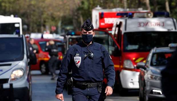 A police officer is seen at the scene of an incident near the former offices of French magazine Charlie Hebdo, in Paris.
