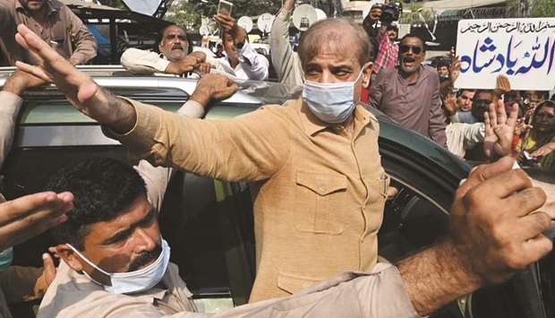 Opposition Leader Shehbaz Sharif gestures as he leaves the High Court in Lahore yesterday.