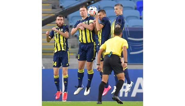 Pakhtakor players form a defensive wall during AFC Champions League Group B match against Shahr Khodro at Al Janoub Stadium on Wednesday. PICTURE: Noushad Thekkayil