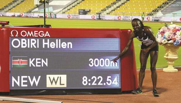 Kenyau2019s Hellen Obiri celebrates after setting a world leading time in the womenu2019s 3,000 metres at the Doha Diamond League meeting at the Suheim bin Hamad Stadium yesterday,  PICTURES: AFP, Ramchand, Shemeer Rashid and Noushad Thekkayil