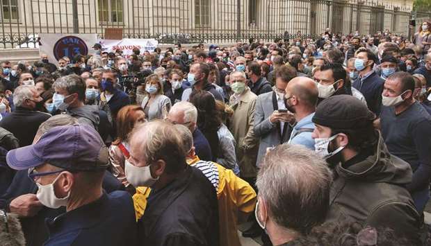 Hundreds of restaurant and bar owners protest in Marseille, France, after French authorities announced that cafes and restaurants must shut down for two weeks to curb the spread of the coronavirus.