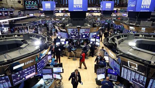 Traders work on the floor of the New York Stock Exchange (file). Some US stocks could face more volatility next week as President Donald Trump and rival Joe Biden face off in their first debate ahead of a November election that betting services currently view as almost a coin flip.