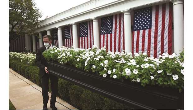 White House staff prepare the Rose Garden at the White House before President Trump announces his Supreme Court nominee.