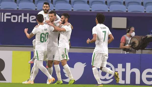 Al Ahli Saudiu2019s Omar al-Soma (centre) celebrates after scoring a goal with his teammates during the AFC Champions League Round of 16 tie against Shabab Ali Ahli Dubai at Al Janoub Stadium yesterday. PICTURE: Noushad Thekkayil