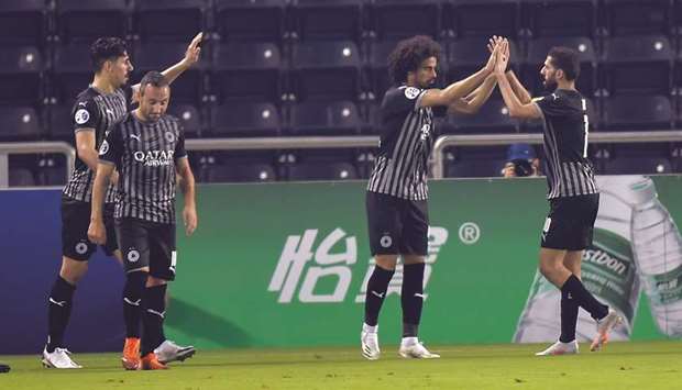 (From left) Al Saddu2019s Baghdad Bounedjah, Santi Cazorla, Akram Afif and Hassan al-Haydos celebrate a goal during their AFC Champions League group stage campaign. PICTURES: Noushad Thekkayil
