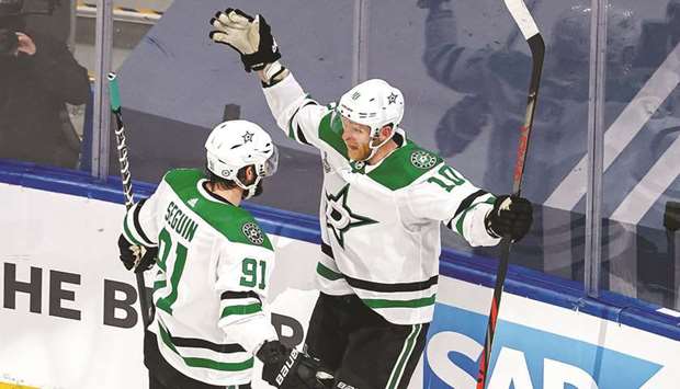 Corey Perry (right) of the Dallas Stars is congratulated by teammate Tyler Seguin after scoring a goal against the Tampa Bay Lightning in Game Five of the 2020 NHL Stanley Cup Final in Edmonton, Canada, on Saturday. (AFP)