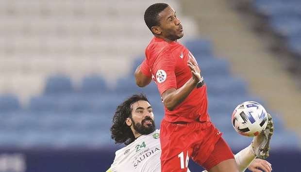 Al Ahli Saudiu2019s Hussein Abdulghani (left) vies for the ball with Shabab Al Ahli Dubaiu2019s Saeed Ahmed during the AFC Champions League Round of 16 tie on Saturday. PICTURE: Noushad Thekkayil