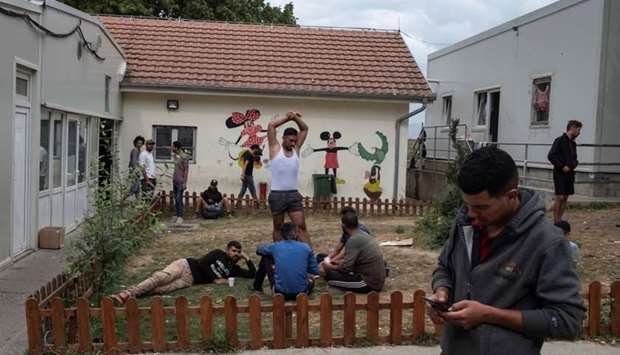 Migrants take a rest at One Stop Center for Migrants, near the border with Hungary in Subotica, Serbia, September 25