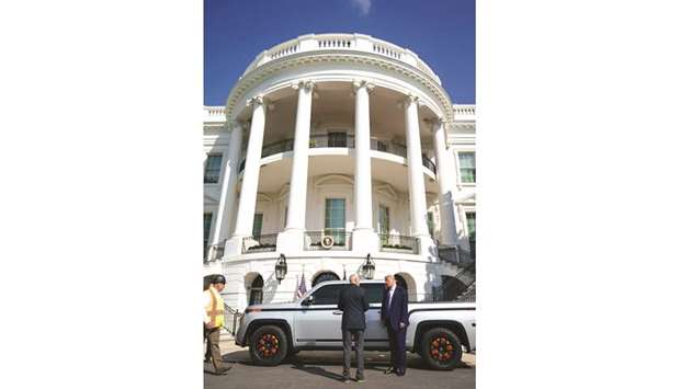 President Donald Trump listens to Lordstown Motors CEO Steve Burns in front of the Endurance pickup truck on the south driveway of the White House in Washington, DC yesterday.