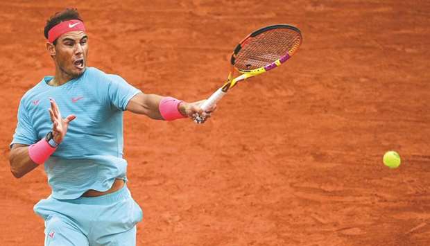 Spainu2019s Rafael Nadal plays a forehand return against Belarusu2019 Egor Gerasimov (not pictured) during their French Open first round match at the Philippe Chatrier court at Roland Garros in Paris, France, yesterday. (AFP)