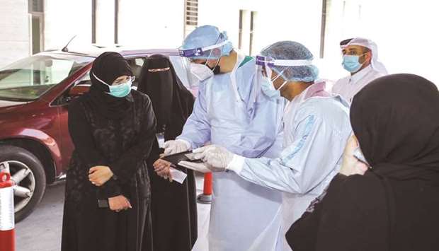 HE Dr Hanan Mohamed al-Kuwari, Minister of Public Health, at a drive-through testing centre.