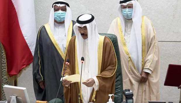 Kuwaitu2019s new Amir HH Sheikh Nawaf al-Ahmad al-Sabah holds a paper as he takes the oath of office at 