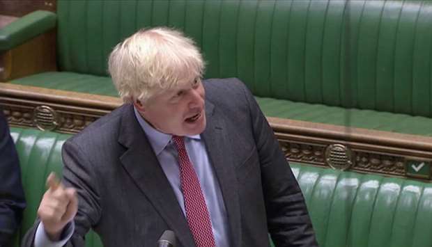 Britain's Prime Minister Boris Johnson gestures as he speaks during the weekly question time debate in Parliament in London, Britain