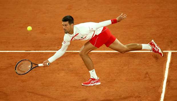 Serbiau2019s Novak Djokovic in action during his French Open first round match against Swedenu2019s Mikael Ymer (not pictured) at Roland Garros in Paris, France, yesterday. (Reuters)