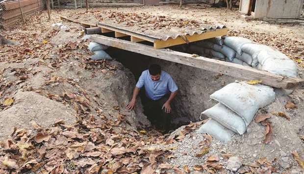 A man leaves a makeshift bomb shelter in the village of Sahlabad, outside the Azerbaijani city of Tartar.