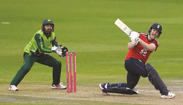 File photo of Englandu2019s Eoin Morgan hitting a six as Pakistanu2019s Mohamed Rizwan keeps wicket during an international Twenty20 match in Manchester on August 28.