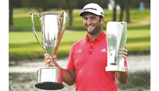 File photo of Jon Rahm of Spain celebrating with the J.D. Wadley trophy and the BMW trophy after winning on the first sudden-death-playoff hole against Dustin Johnson during the final round of the BMW  Championship on the North Course at Olympia Fields Country Club on August 30, 2020 in Olympia Fields, Illinois.