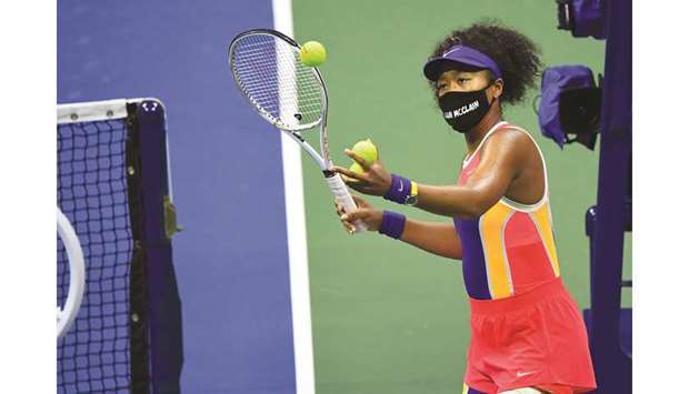 Naomi Osaka of Japan hits balls into the stands following her win over Camila Giorgi (not pictured) of Italy on day three of the 2020 US Open at USTA Billie Jean King National Tennis Center in Queens borough of the New York City on Wednesday. (USA TODAY Sports)