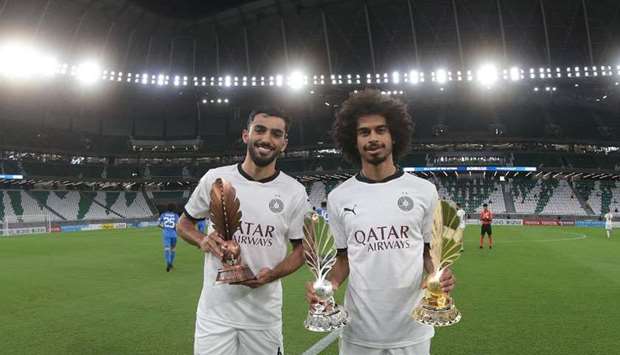 Al Sadd players Akram Afif (right) and Tarek Salman were handed over their QFA Award trophies. Afif was named the Best Player and top scorer, while Salman received the player of the year award in the under-23 category.