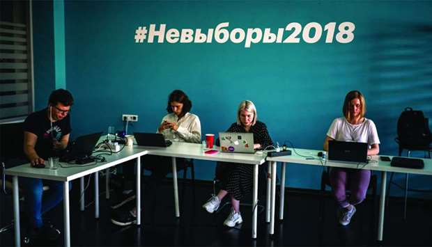 Employees of Navalny's Anti-corruption Foundation (FBK) work at their office in Moscow