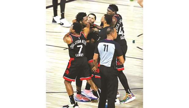 Toronto Raptors forward OG Anunoby (second left) is mobbed by teammates after making the game-winning three point basket against the Boston Celtics in game three of the second round of the 2020 NBA Playoffs in Lake Buena Vista, Florida, on Thursday. (USA TODAY Sports)