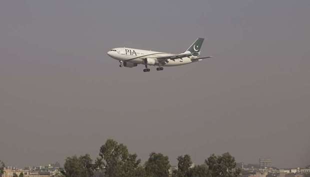 This picture taken in 2015 shows a Pakistan International Airlines (PIA) passenger plane arriving at the Benazir International airport in Islamabad.