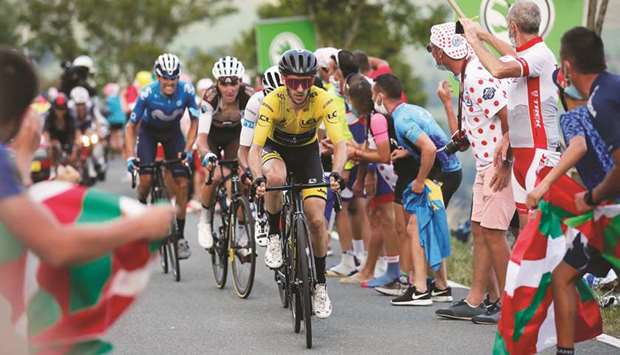 Mitchelton-Scott rider Adam Yates of Britain, wearing the overall leaderu2019s yellow jersey, in action during Stage 8 of the Tour de France. (Reuters)