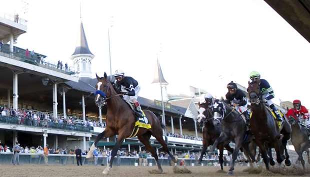 Authentic, ridden by John Velazquez leads the field to the first turn during the 146th running of the Kentucky Derby at Churchill Downs in Louisville on Saturday.