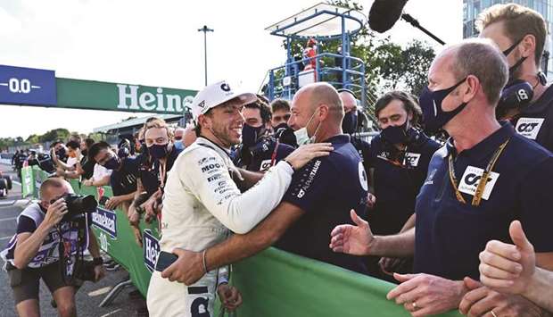 AlphaTauriu2019s French driver Pierre Gasly celebrates his Italian Grand Prix win with teammates at the Autodromo Nazionale circuit in Monza, Italy, yesterday. (AFP)