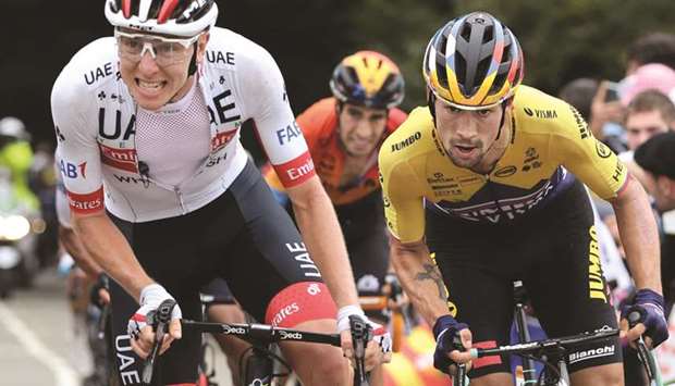Sloveniau2019s Tadej Pogacar (L) and Primoz Roglic ride during the 9th stage of the 107th edition of the Tour de France cycling race, 154 km between Pau and Laruns, yesterday.