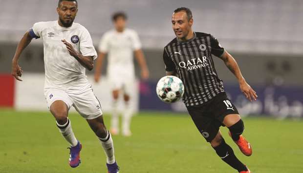 Al Saddu2019s Santi Cazorla (right) and Al Sailiyau2019s Majdi Abdalla Musa vie for the ball during their QNB Stars League match yesterday.