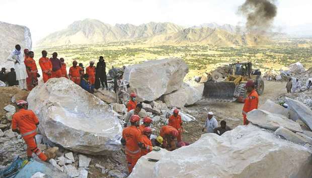 Army rescuers take part in a search for miners after a rockslide at a marble mine in the mountainous Mohmand district in Khyber Pakhtunkhwa province.