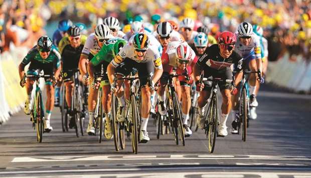Team Deceuninck rider Irelandu2019s Sam Bennett (centre) sprints to win the 10th stage of the 107th edition of the Tour de France yesterday. (AFP)