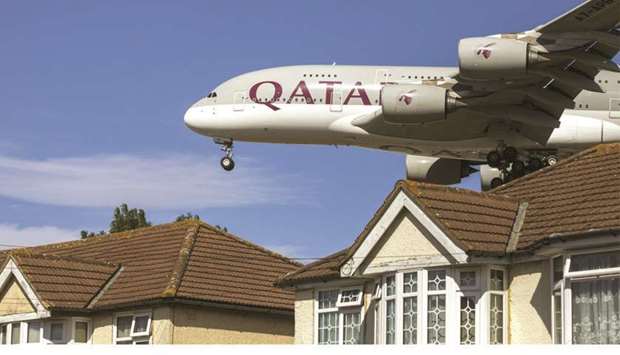 An Airbus A380 passenger aircraft, operated by Qatar Airways, passes residential rooftops as it prepares to land at London Heathrow Airport in London (file).
