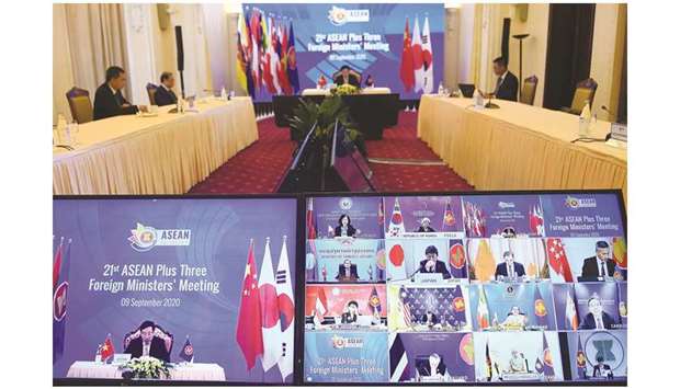 Foreign ministers from Asean countries along with their counterparts from China, Japan and South Korea are seen on a television screen during the 21st Association of Southeast Asian Nations (Asean) Plus Three Foreign Ministersu2019 Meeting, held online due to the coronavirus pandemic, in Hanoi yesterday.